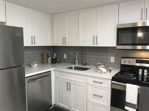 white kitchen with stainless steel walls